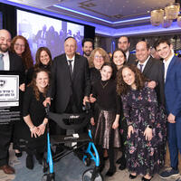 Dr. David Pelcovitz, center, is surrounded by family as he receives the RIETS Lifetime Achievement Award.